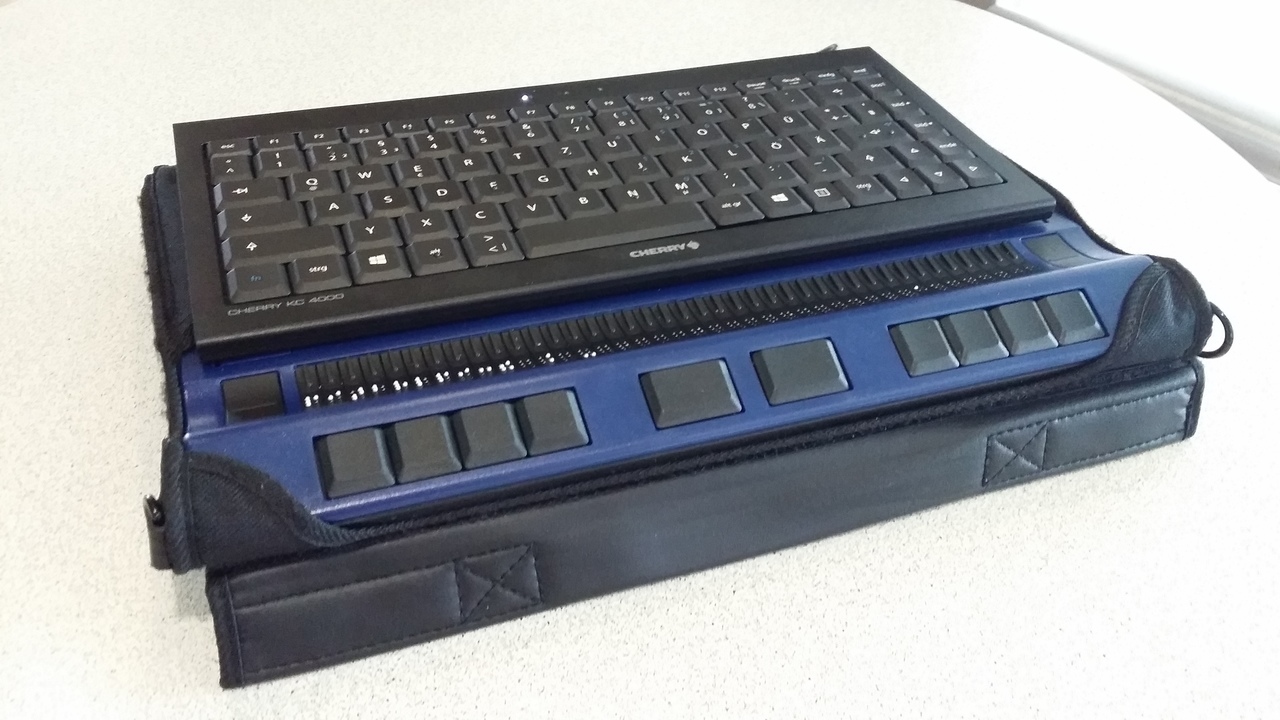 [picture: a braille display with a keyboard on top and a Raspberry Pi Zero inside]